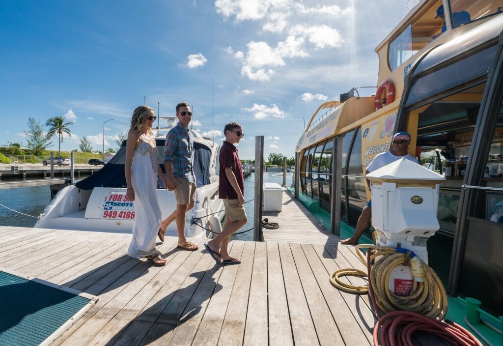 Family boarding a boat in Grand Cayman