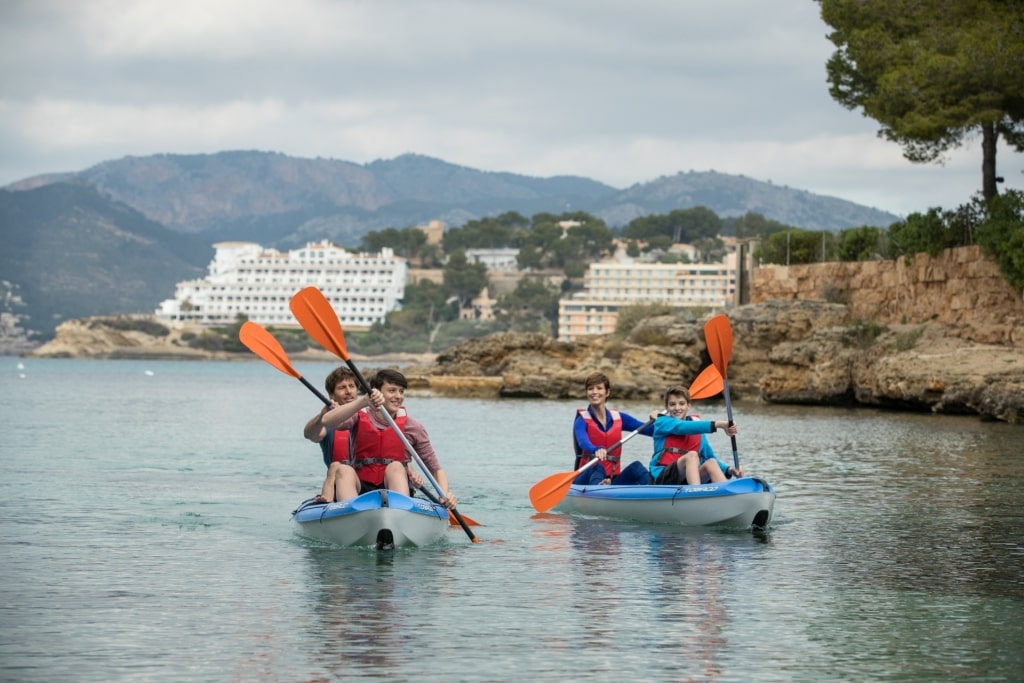 Family kayaking in Palma de Mallorca, Spain