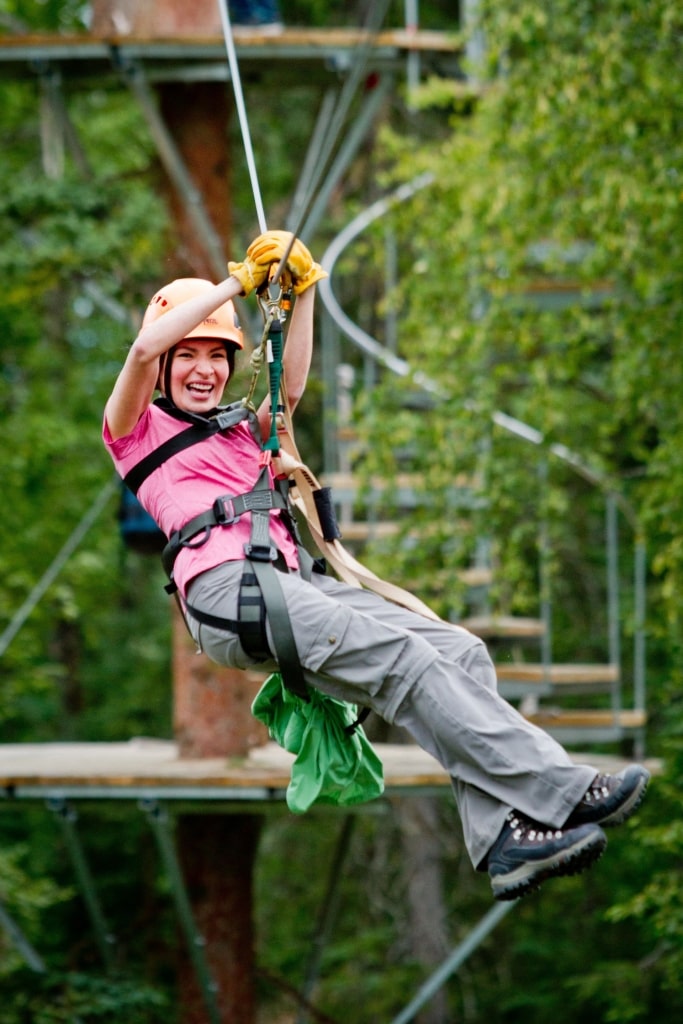 Woman ziplining at the Denali Park Zipline, Denali National Park