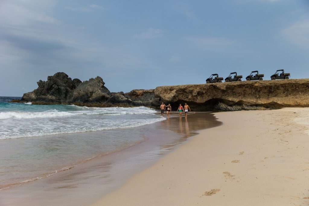 People exploring the beach in Aruba