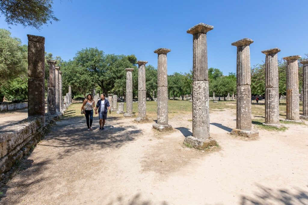 Couple exploring the historic site of Olympia, near Katakolon