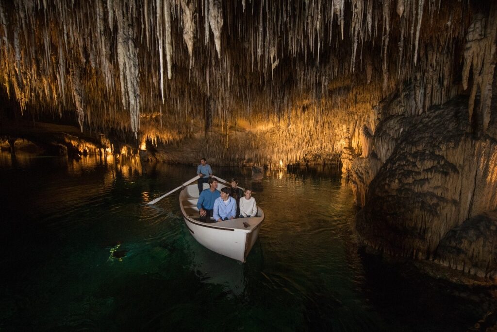 People cruising inside Drach Caves, Mallorca