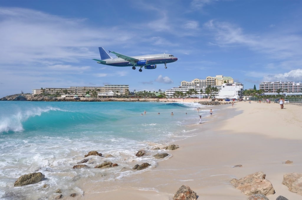 Airplane flying over Maho Beach