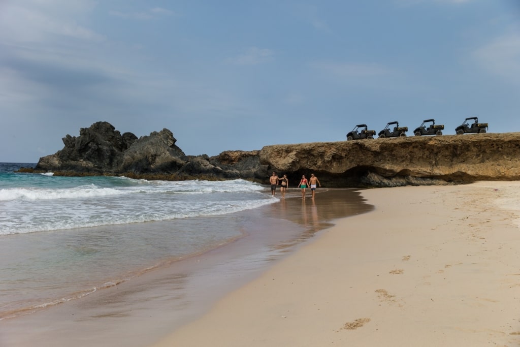 People strolling the beach in Aruba