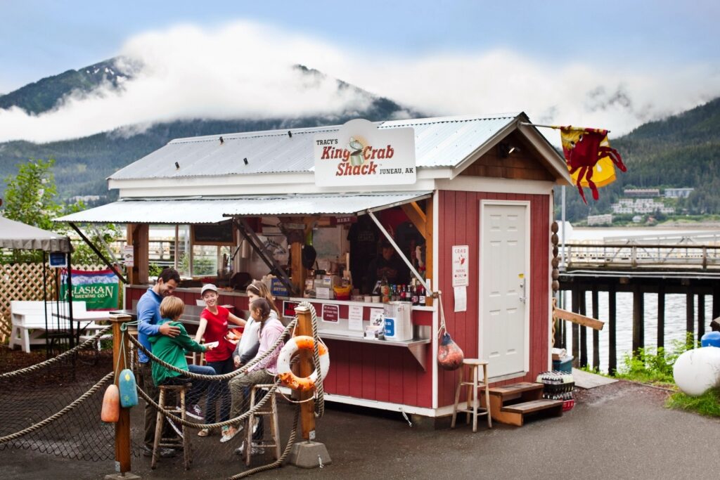 People eating at a King crab shack in Alaska
