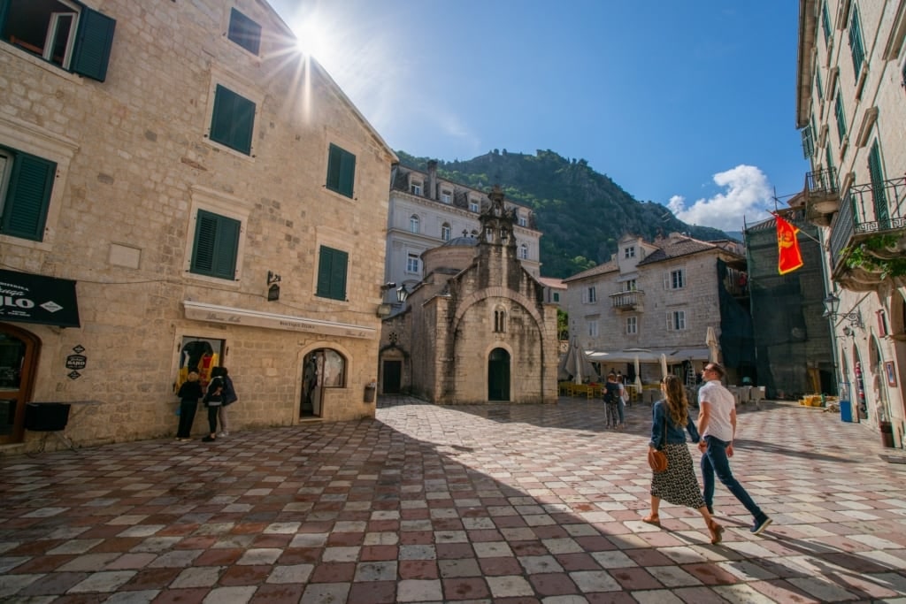 Couple walking around Old Town in Kotor, Montenegro