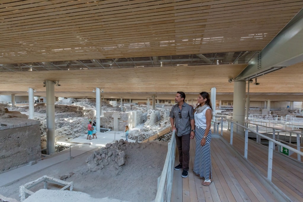 Couple inside Akrotiri in Santorini, Greece