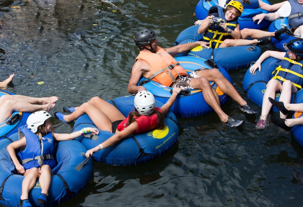 People on a river tubing adventure in Dominica