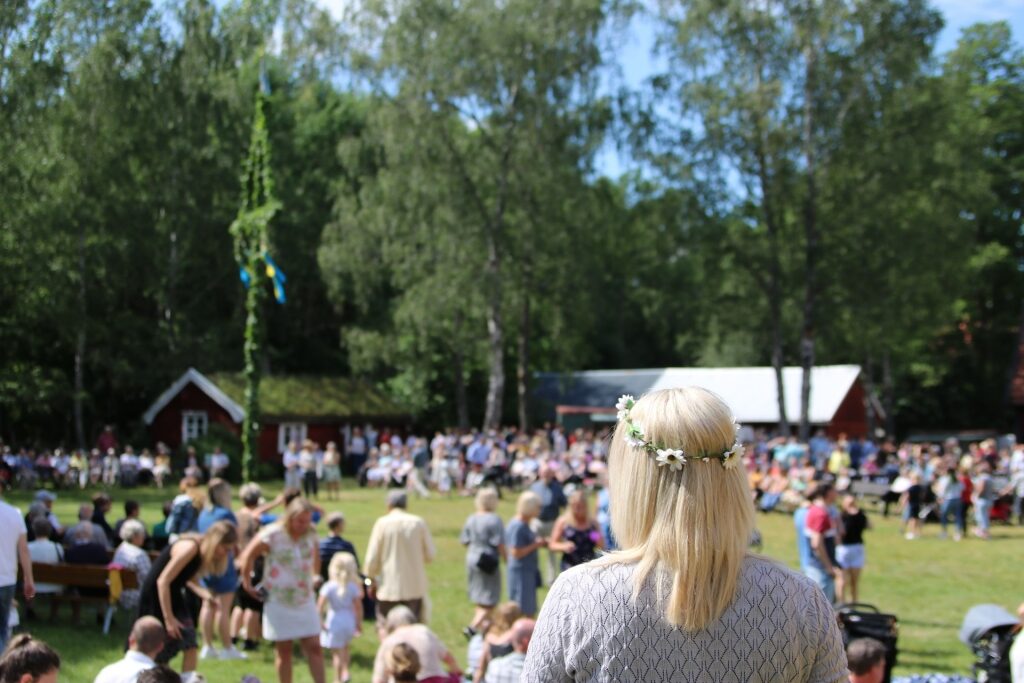 People enjoying the Midsummer celebration in Sweden