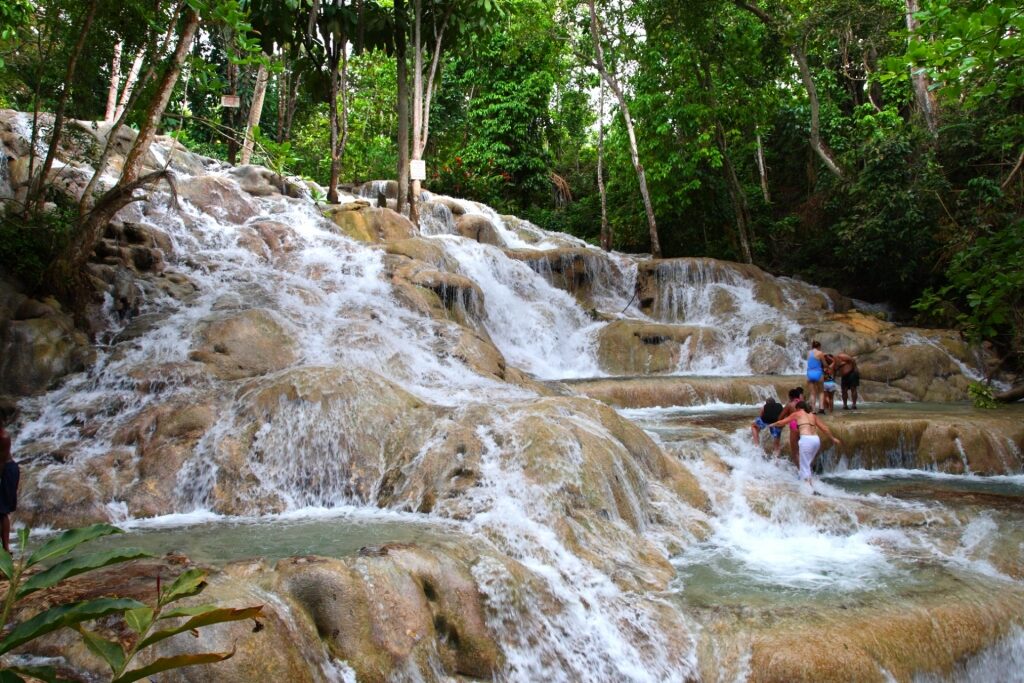 People hiking Dunn’s River Falls, Jamaica