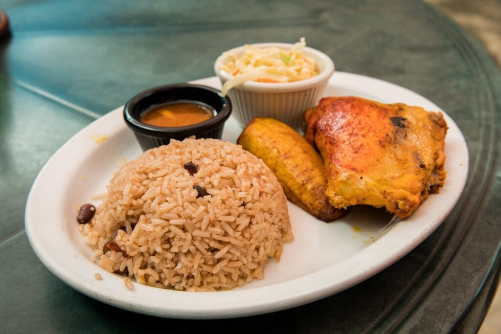 Rice and beans and chicken on a plate