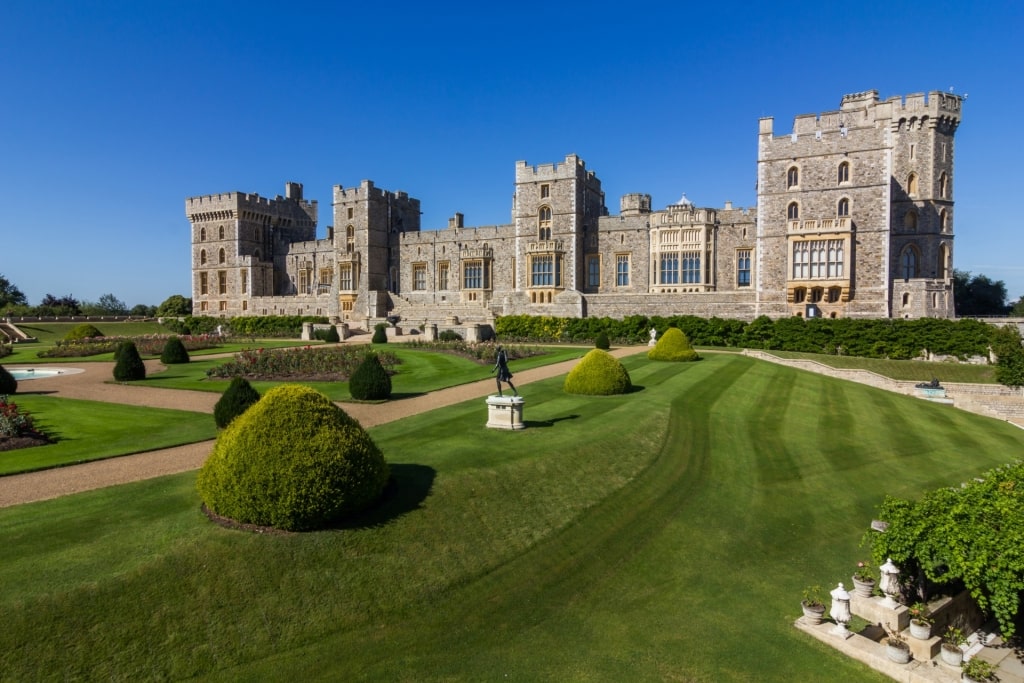 View of the Windsor Castle in Windsor, England with its lush gardens