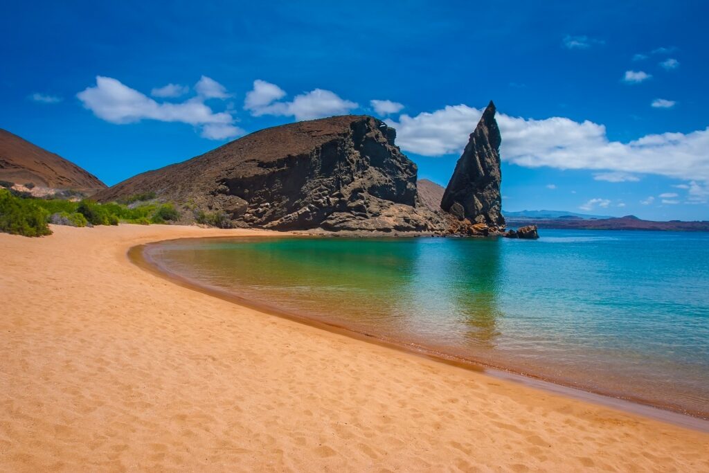 Golden sands of Pinnacle Rock in Isla Bartolomé, Galapagos Islands