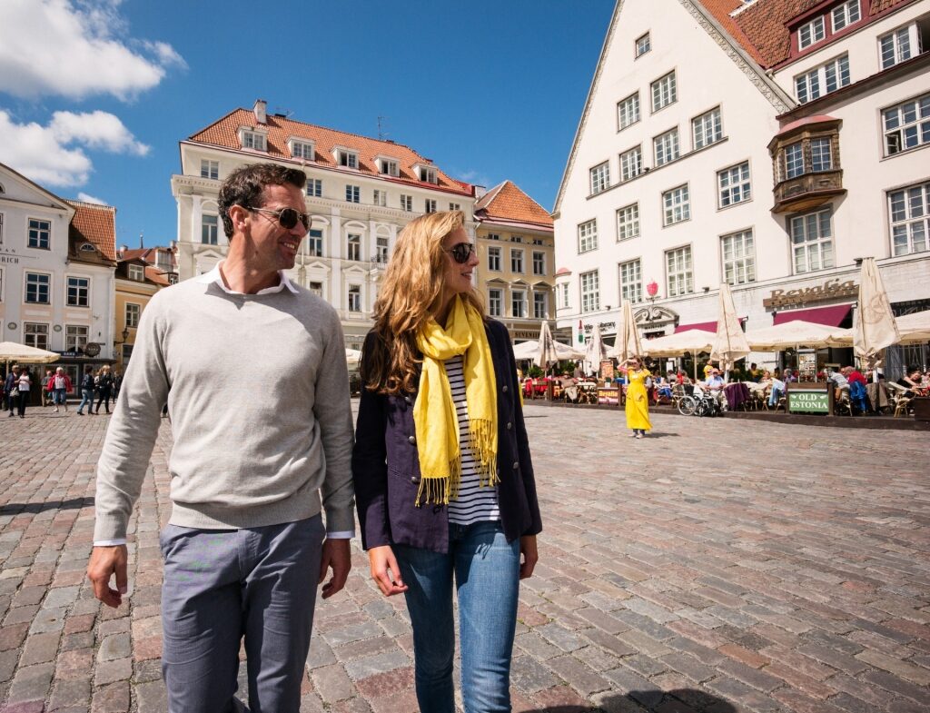 Couple exploring Old Town of Tallinn, Estonia