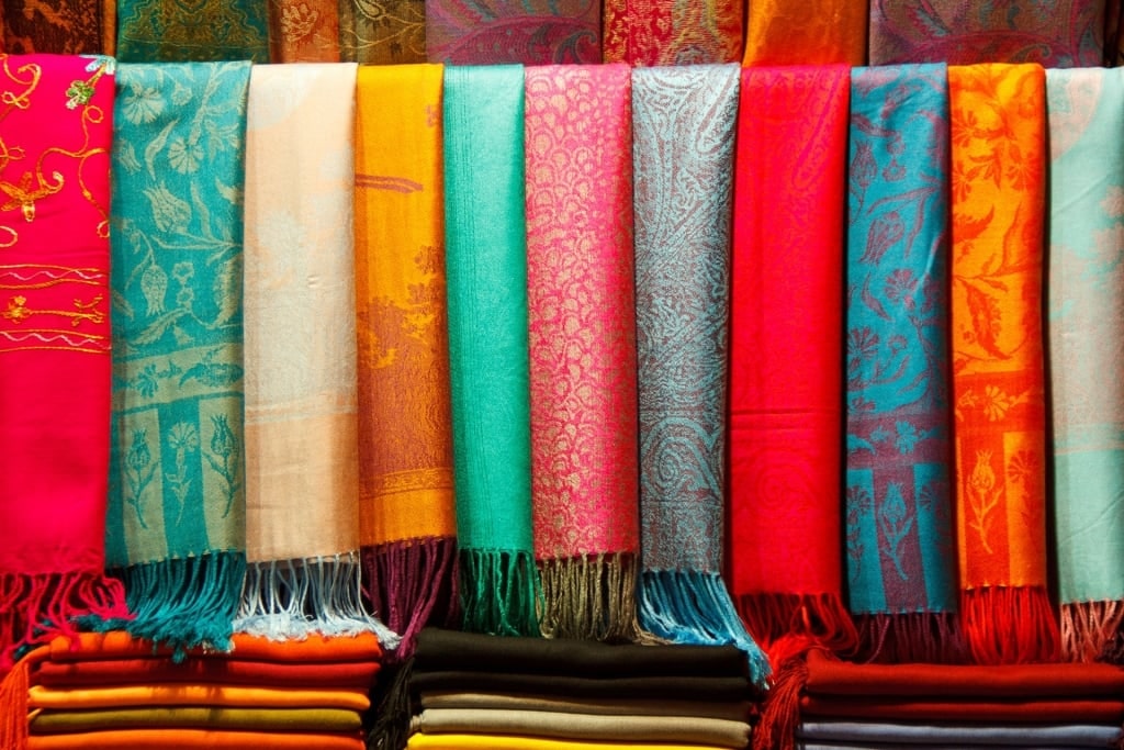 Colorful pashminas at a market in Spain