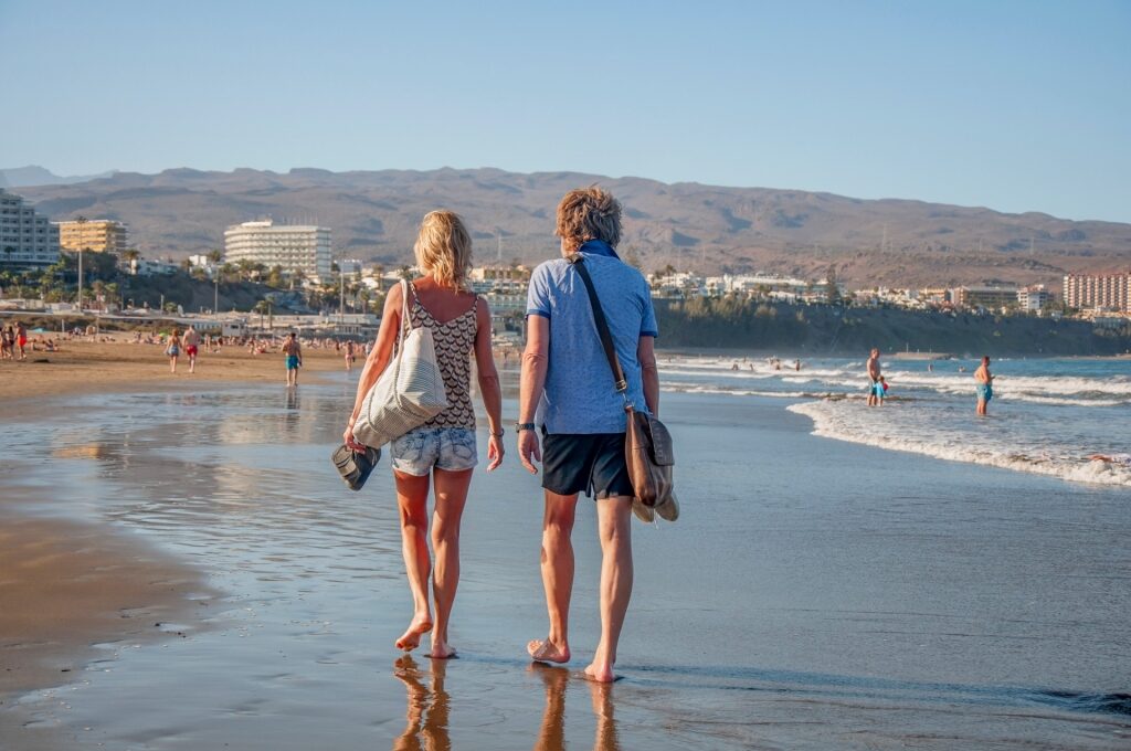 Couple exploring a beach in Spain