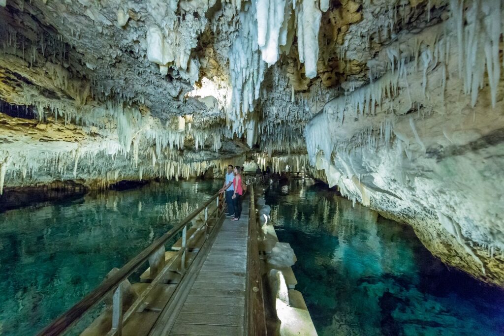 Couple exploring the Crystal Caves, Bermuda