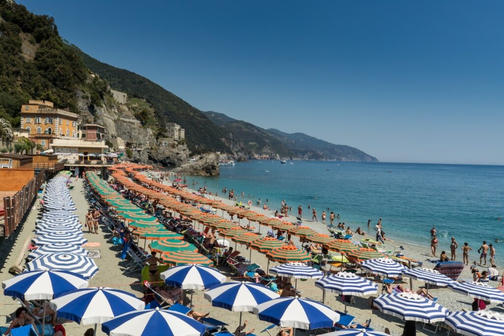 Umbrellas lined up on Monterosso Beach in Cinque Terre