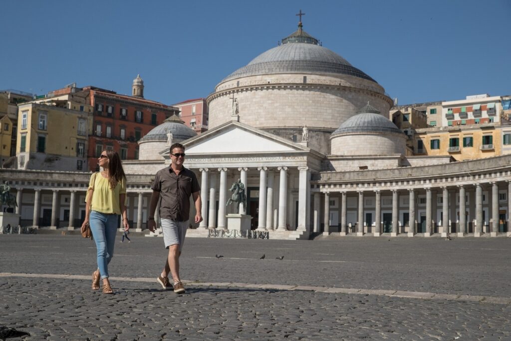 Couple strolling Piazza del Plebiscito, Naples