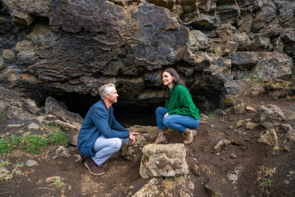 Couple exploring Dimmuborgir Lava Field