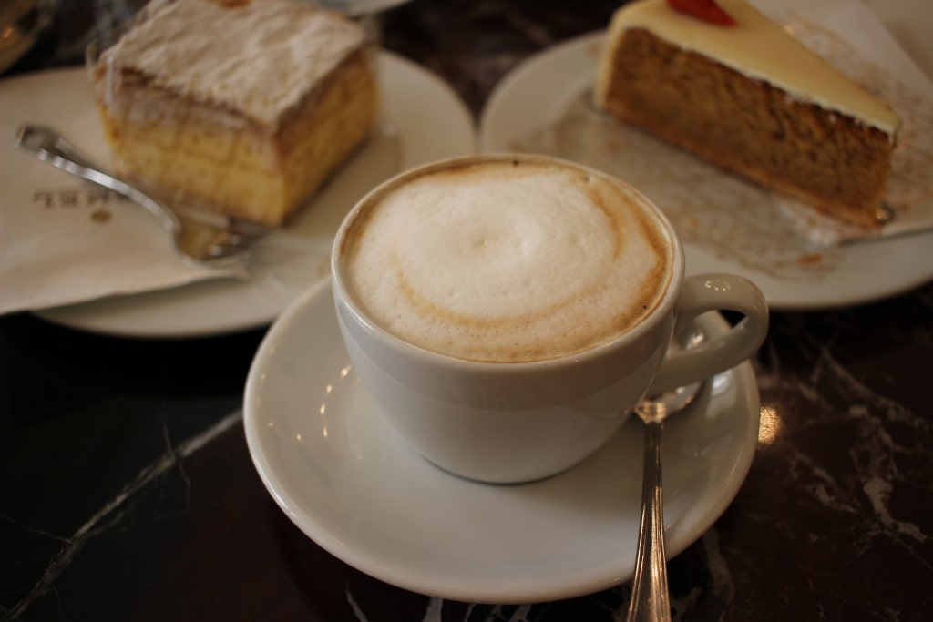 Cup of wiener melange with pastries