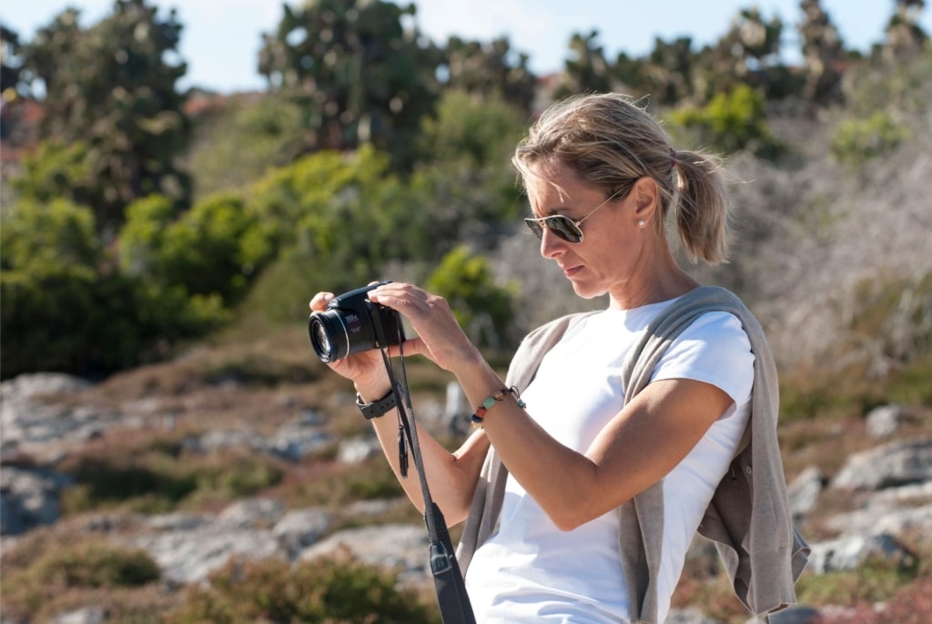Woman taking a photo in the Galapagos