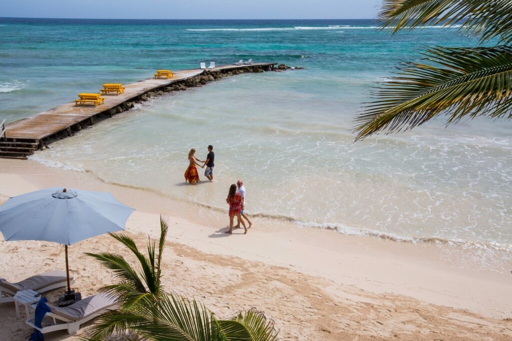 People strolling on the beach in Jamaica