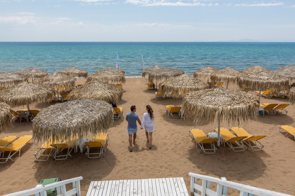 Couple exploring a beach in Katakolon