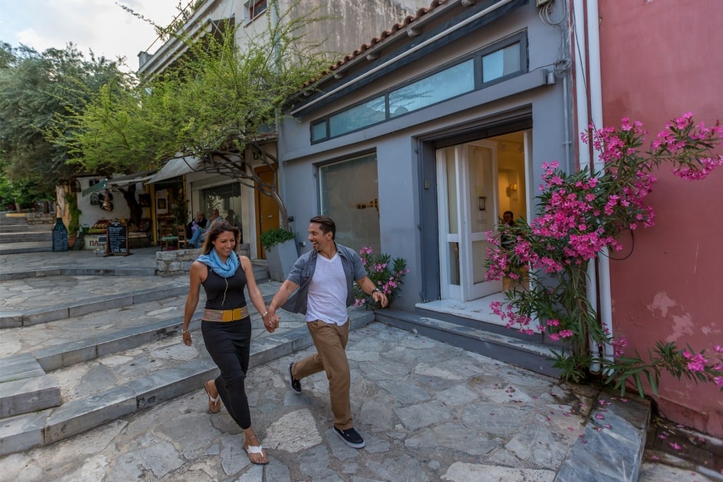 Couple walking the streets of Plaka, Athens