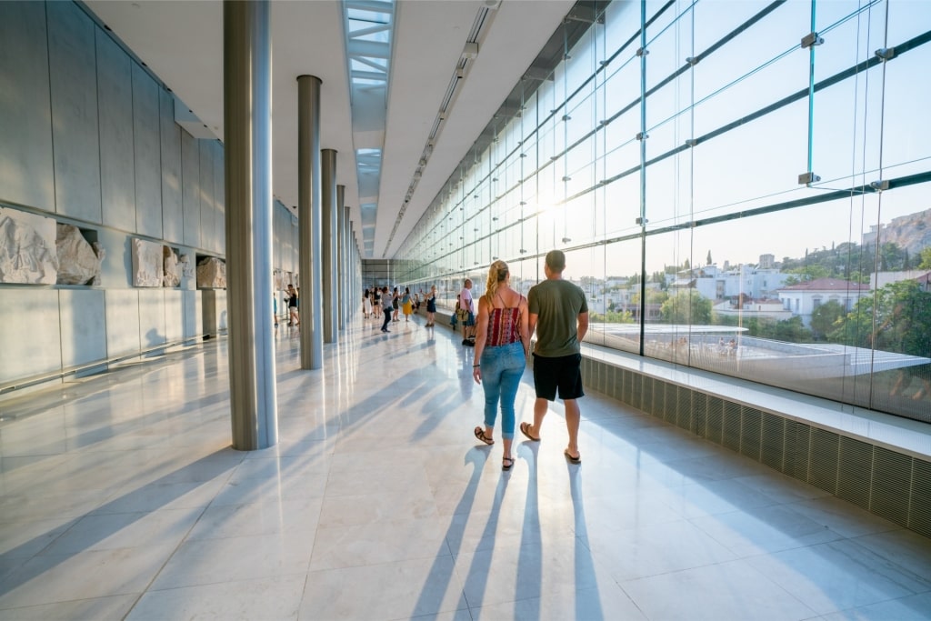 Couple exploring the Acropolis Museum, Athens 