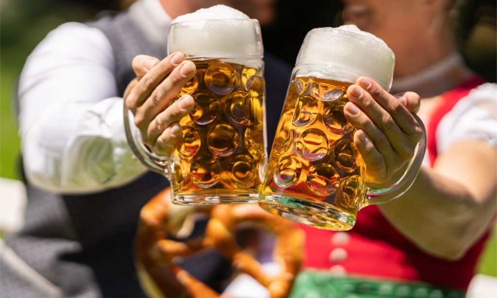 People wearing dirndls and lederhosen during Oktoberfest