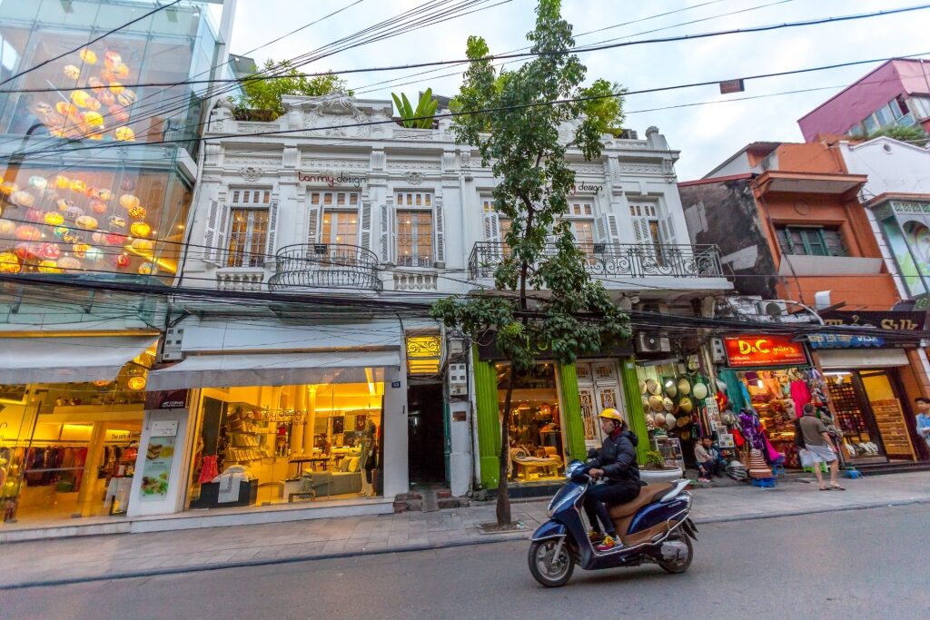 Moped driving along Old Quarter in Hanoi, Vietnam