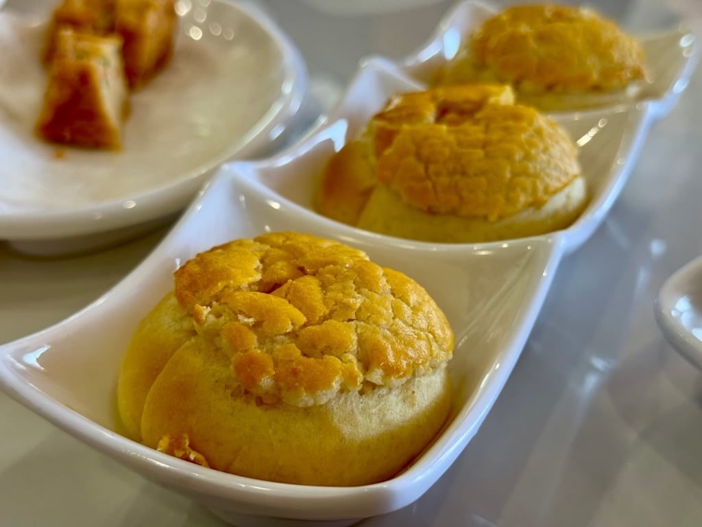 Delicious bo lo bao on pineapple buns on a platter