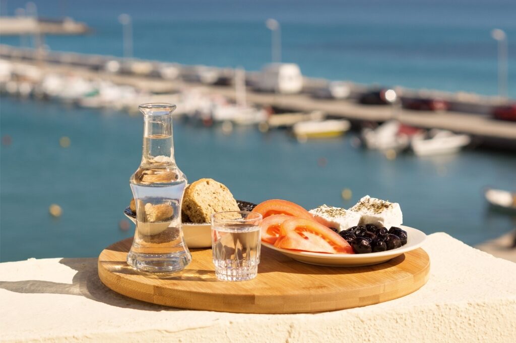 Bottle of raki with food on the side