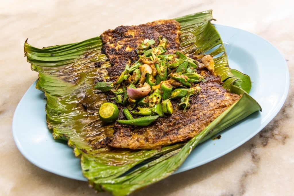Sambal stingray on a plate with shrimp paste