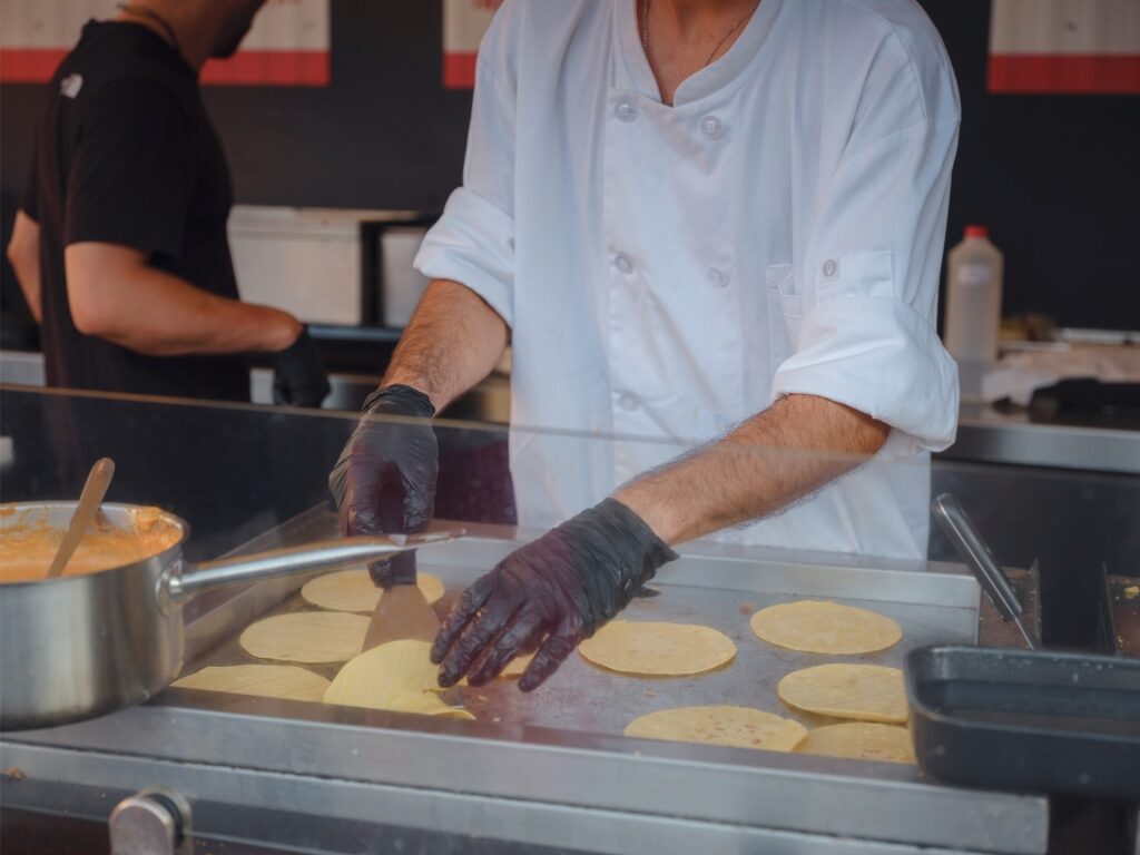 Man cooking inside a restaurant in Vienna