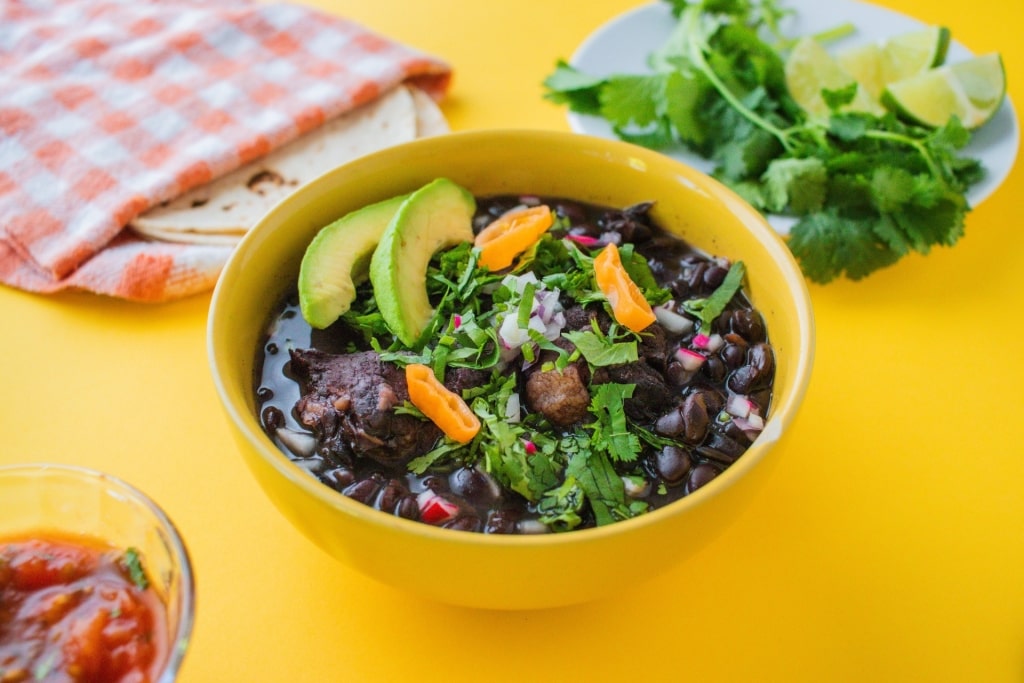 Bowl of colorful Frijol con Puerco