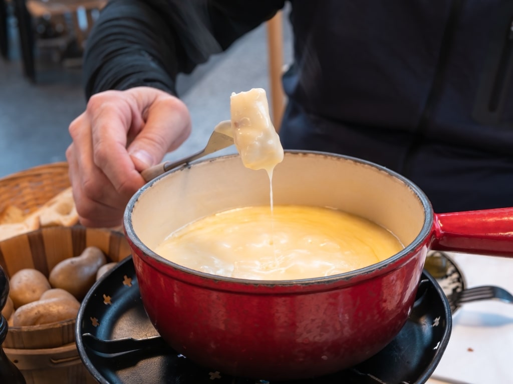 Man eating cheese fondue