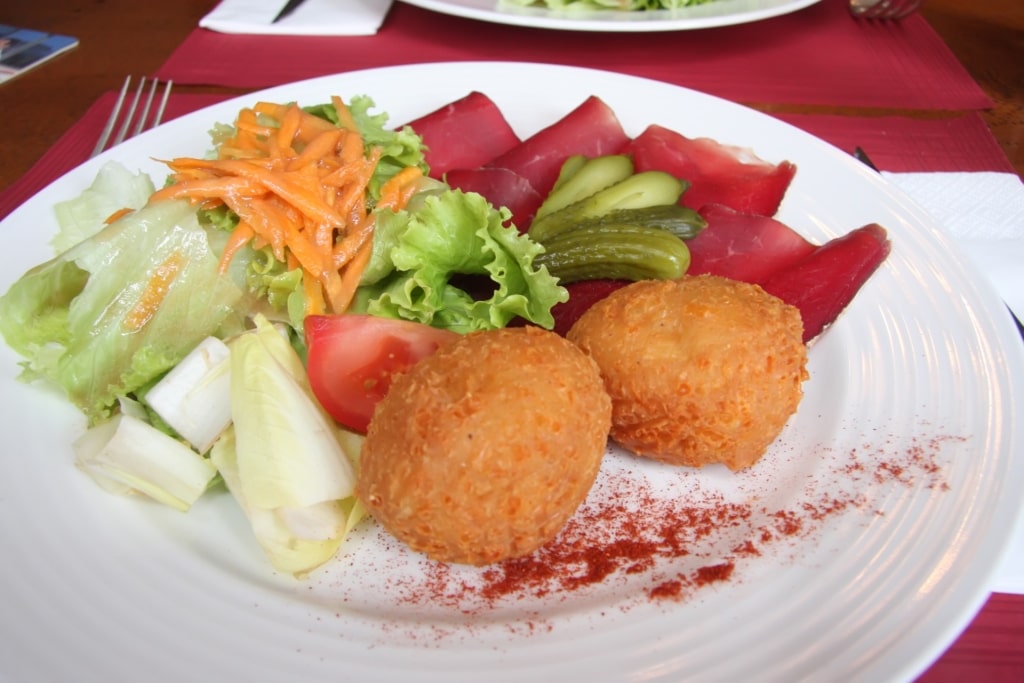 Platter of crispy malakoffs with veggies on the side