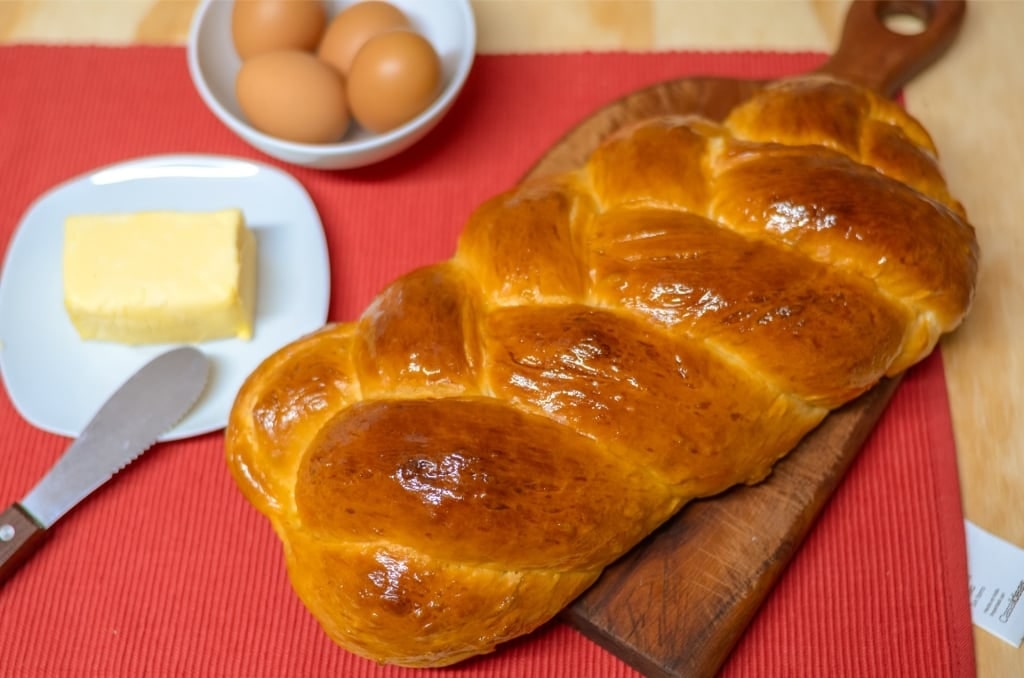 Freshly baked zopf with butter on the side