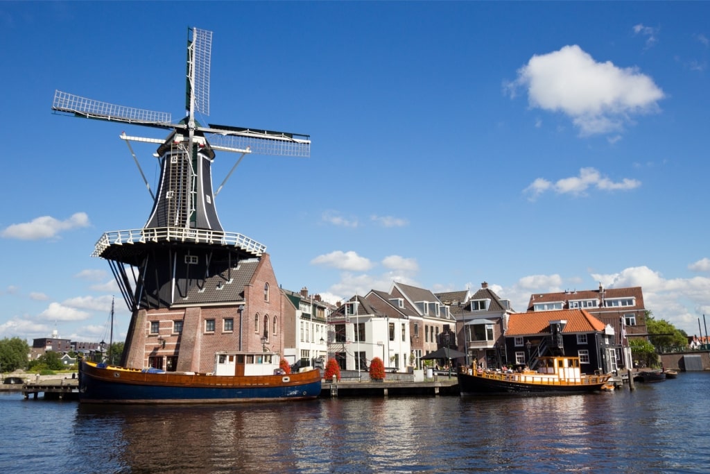 Molen De Adriaan windmill along Amsterdam riverbank
