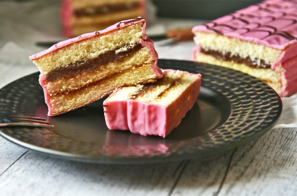 Slices of Punschkrapfen cake with rum-flavored filling