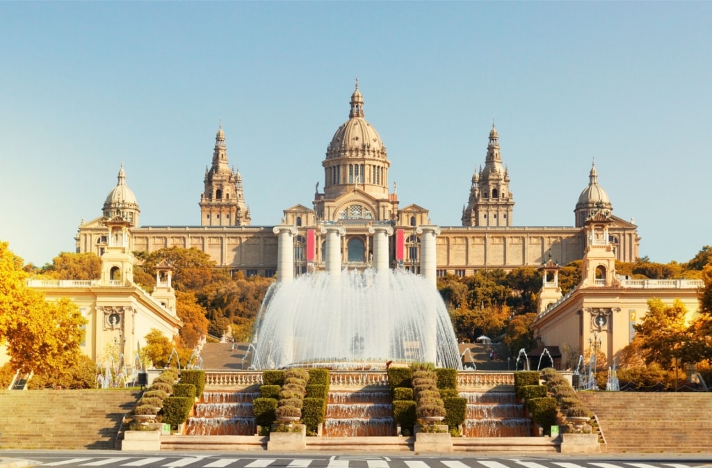 Massive Museu Nacional d'Art de Catalunya with fall foliage