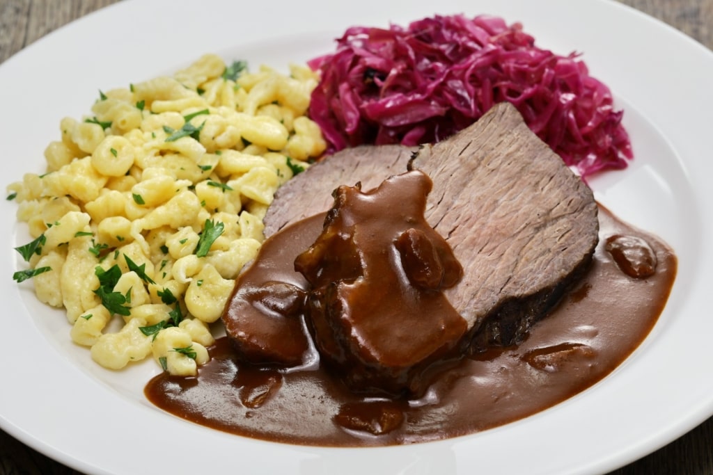 Sauerbraten, a sweet-and-sour roast with side dishes