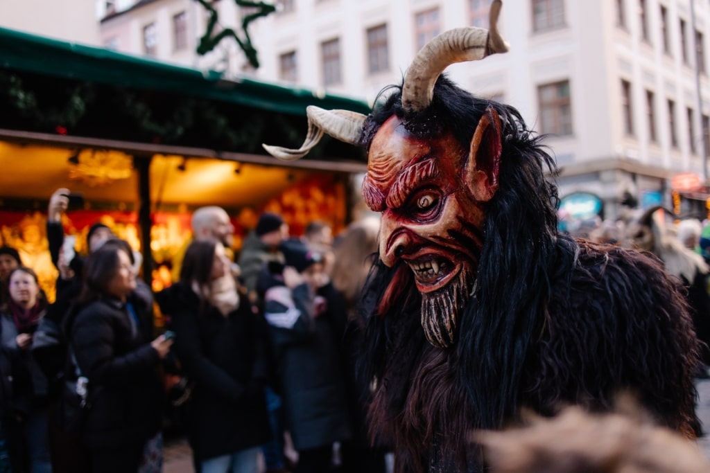 Close-up of Krampus costume featuring mask at a parade