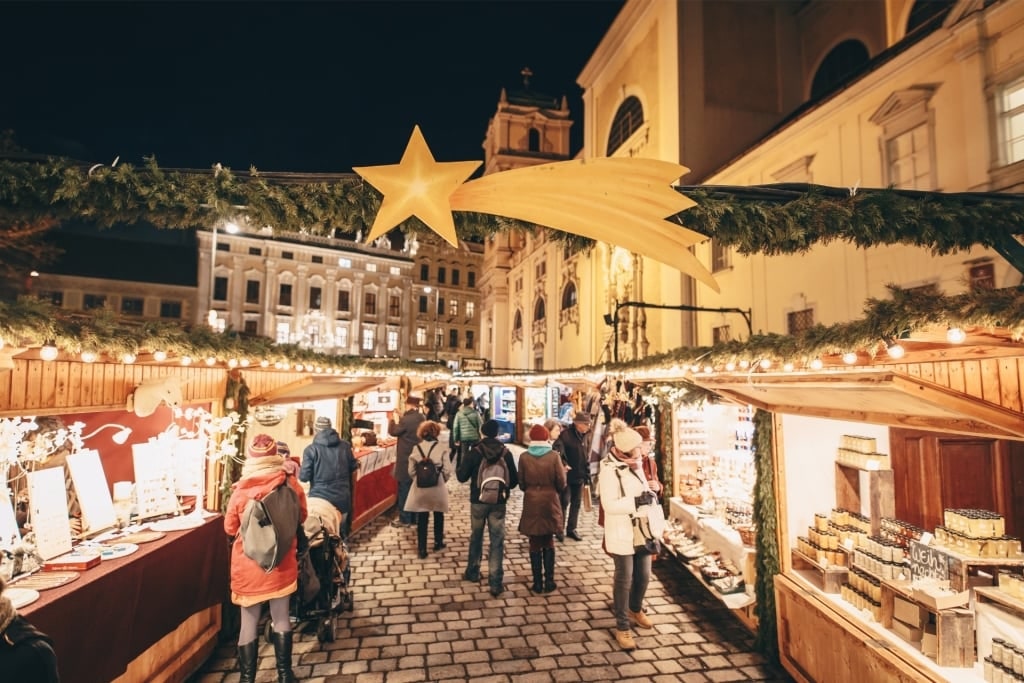 Evening view of Vienna Altwiener Christmas market with lights and crowds