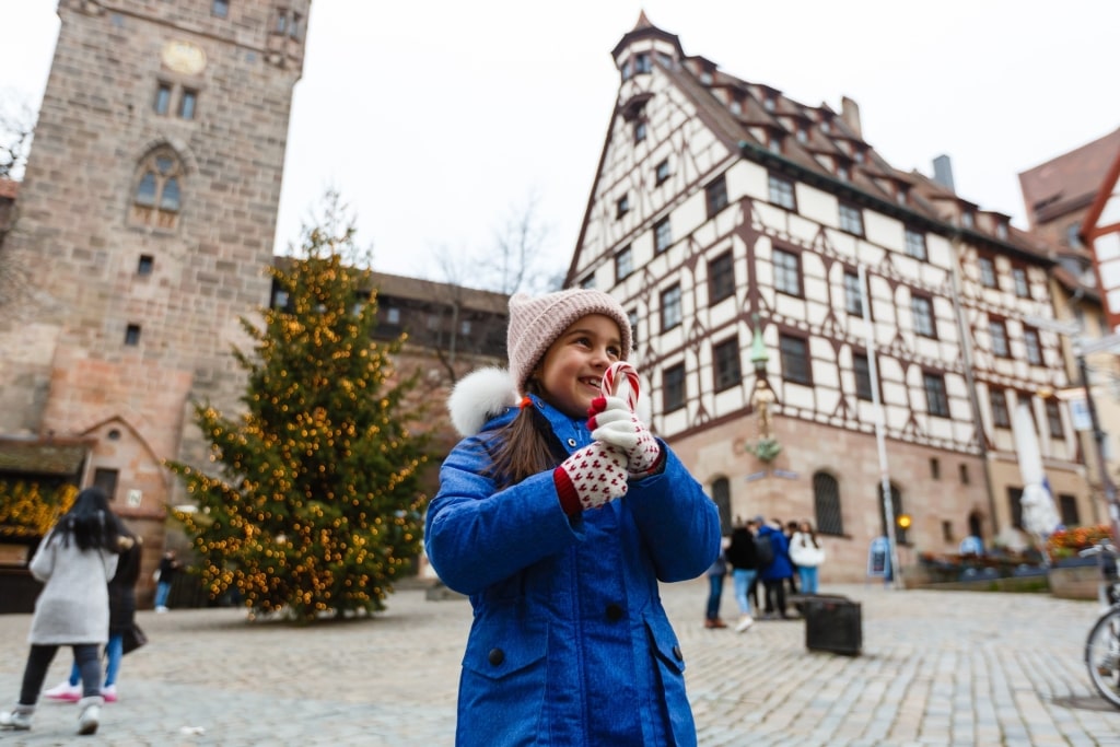 Child enjoying Christmas market in Nuremberg, Germany