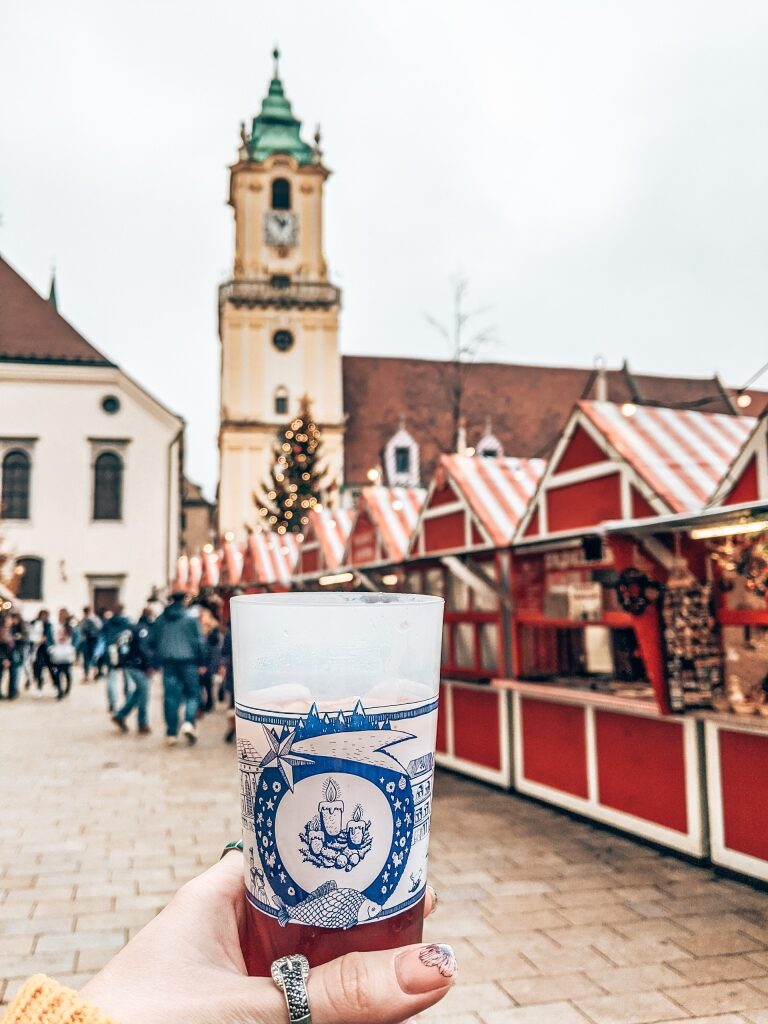 Person holding a cup of mulled wine