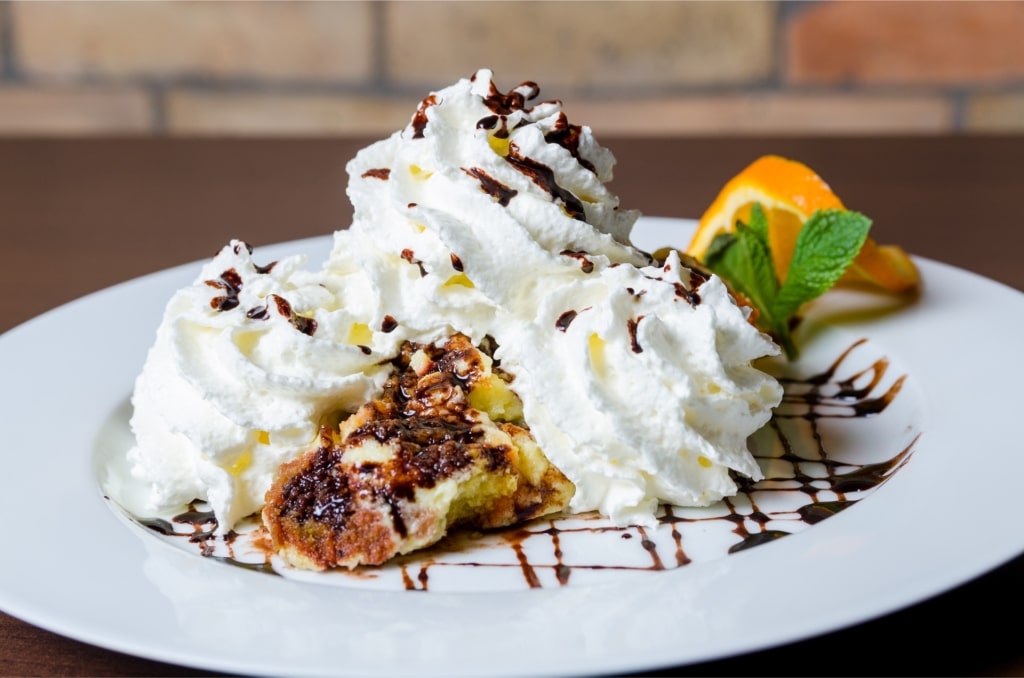 Hungarian dessert Somlói Galuska with sponge cake and cream