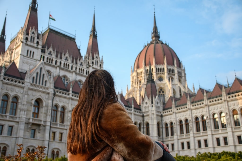 Woman gazing at the beautiful Hungarian Parliament